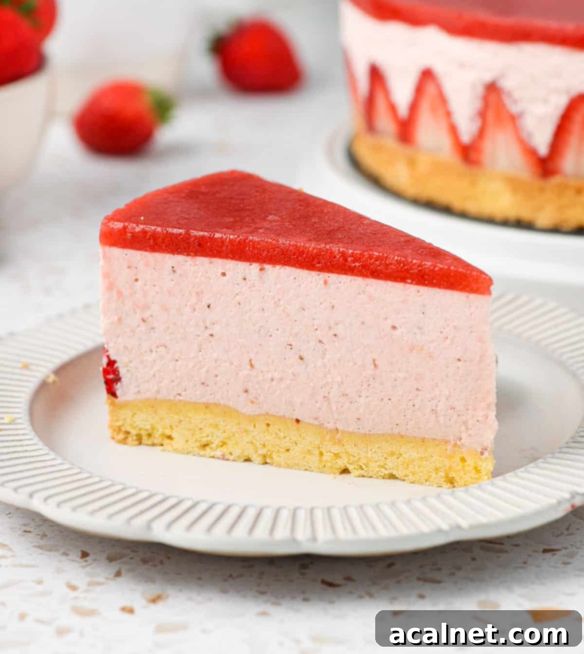 Airy Strawberry Dream Cake 10 One slice of cake on a small white plate.