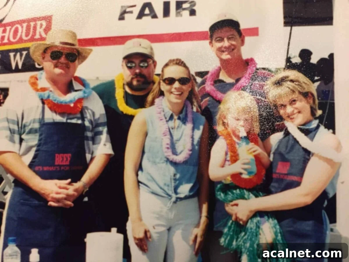 Six people in front of a banner at the Western Idaho Fair, 1999.