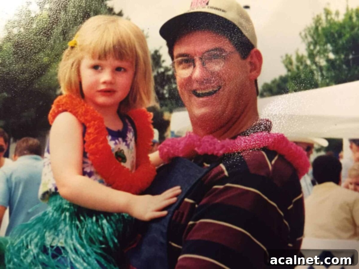 Madeline in Mike's arms, 1999.