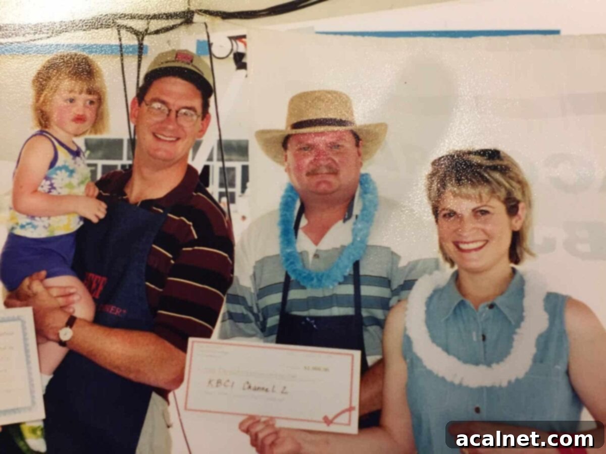 Melinda's family and friends holding the winning certificate.