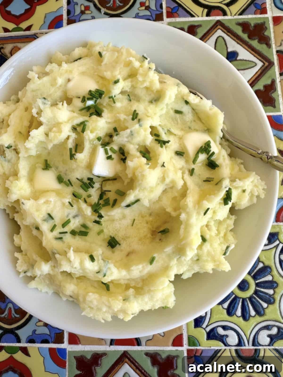 A bowl of freshly prepared Yukon Gold mashed potatoes, ready to be served.