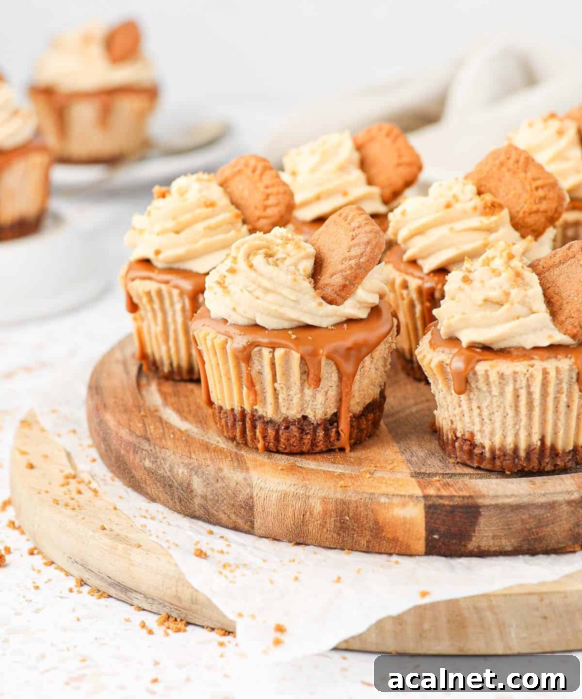 Cheesecakes on a round wooden board.