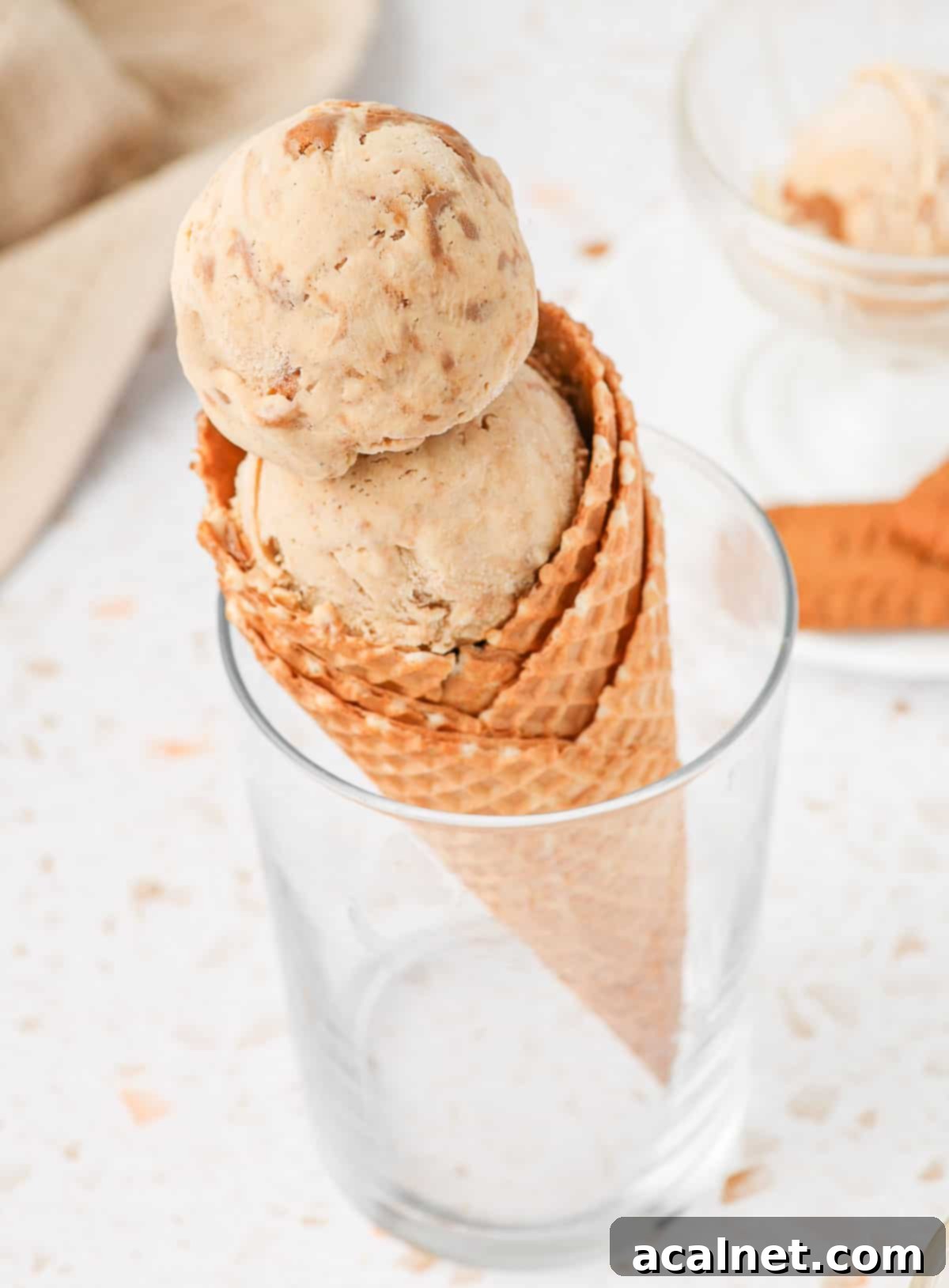 Two scoops in a waffle cone.