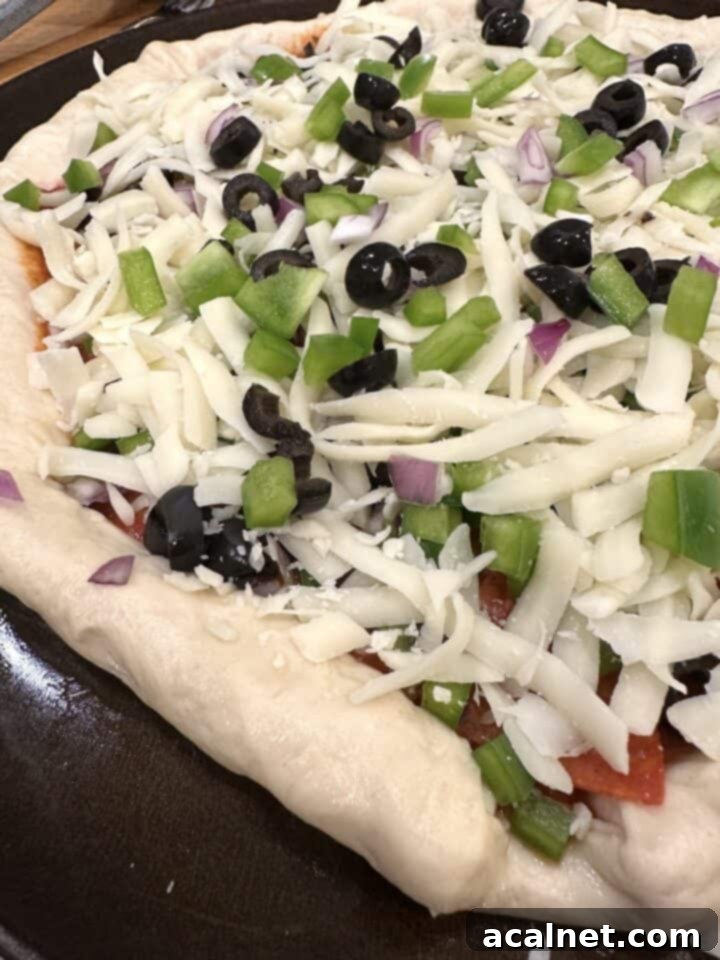 Unbaked pizza with toppings.