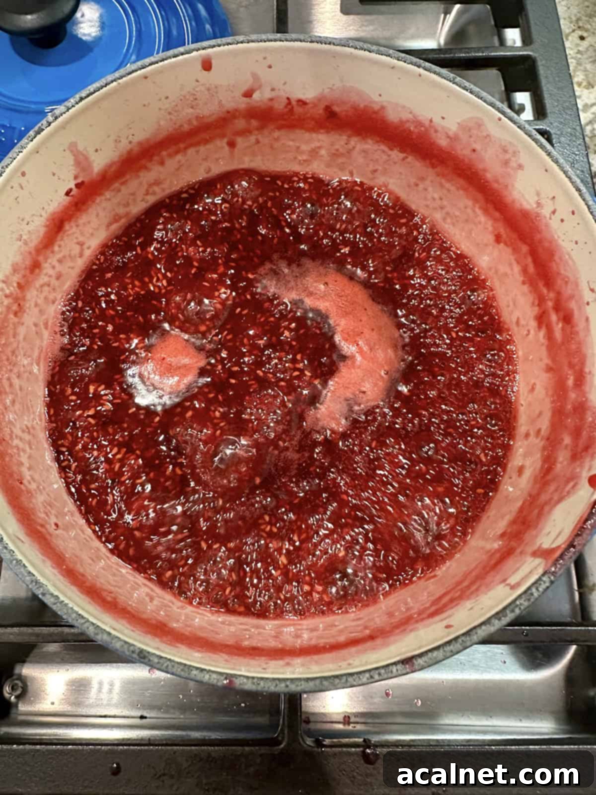 Raspberry jam boiling on the stove, no pectin and no canning.