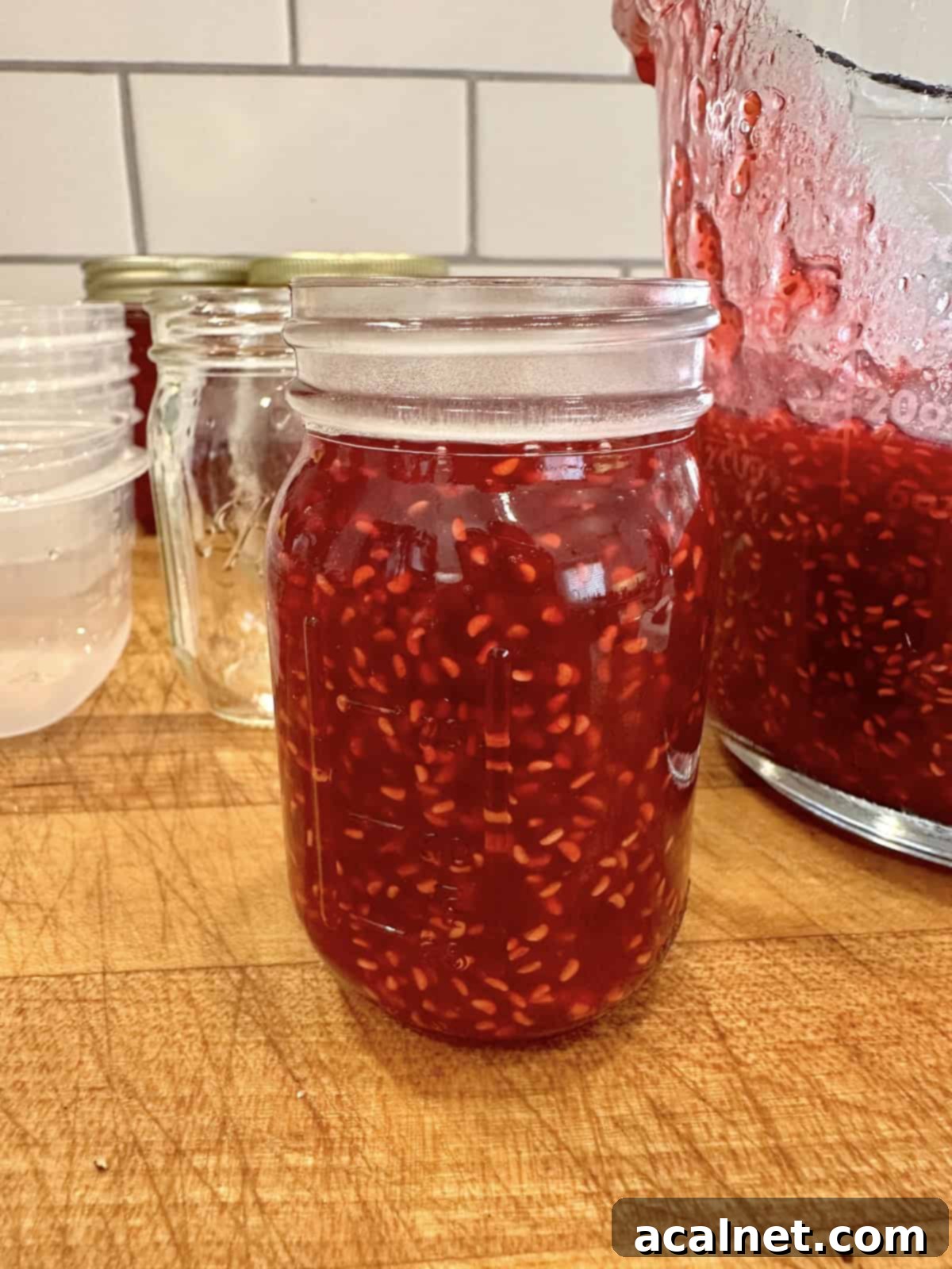 Easy, small batch raspberry freezer jam in jars.