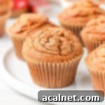 Close up on a biscoff muffin on a large white plate.