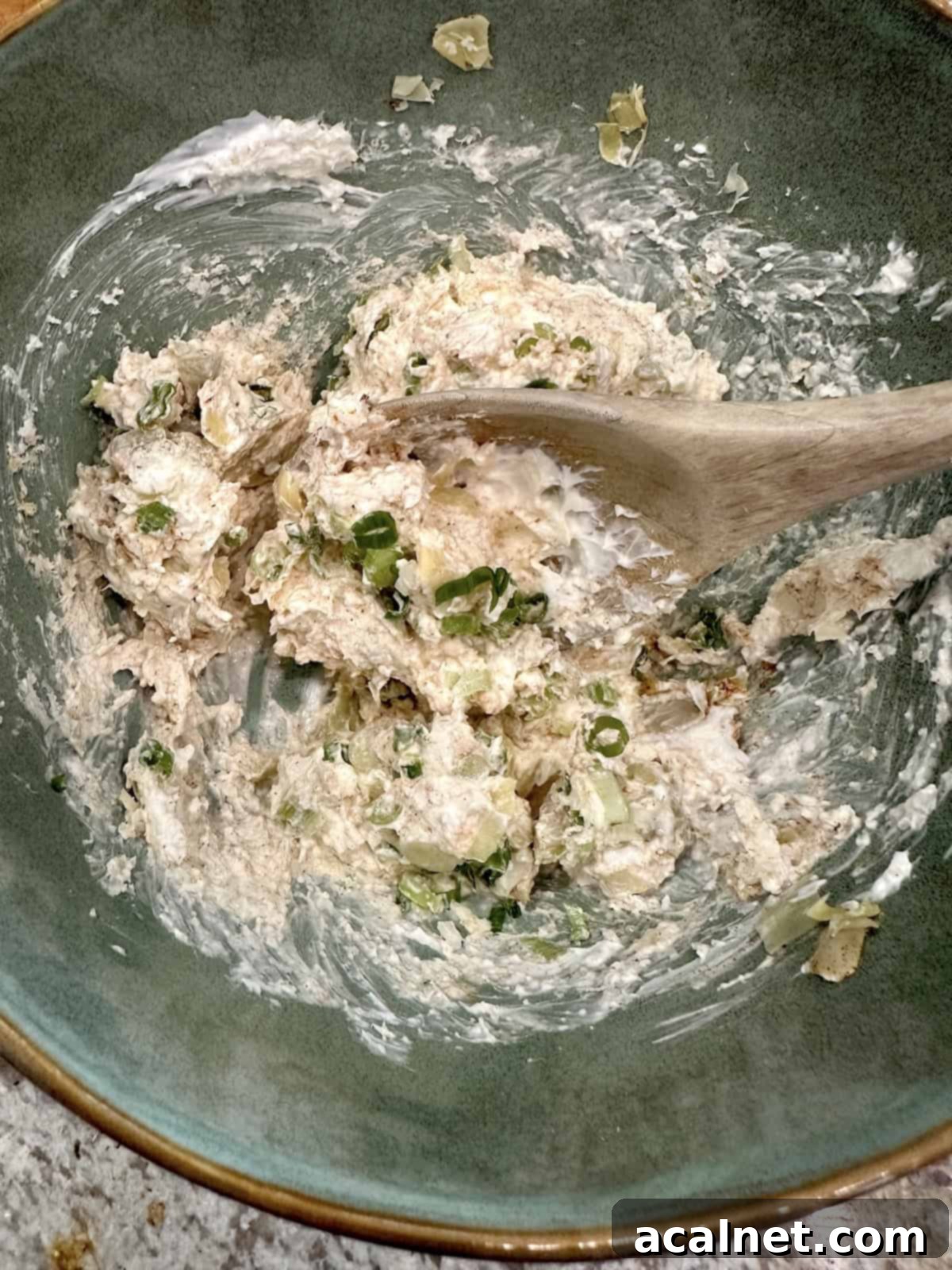 Irresistible Crab and Shrimp Dip 10 The blended creamy ingredients for seafood dip in a bowl, showing a smooth, consistent texture.