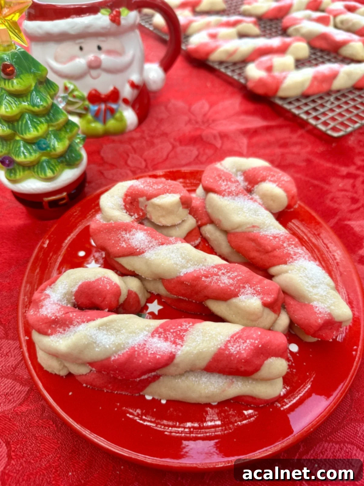 Candy cane cookies on a plate on a table.