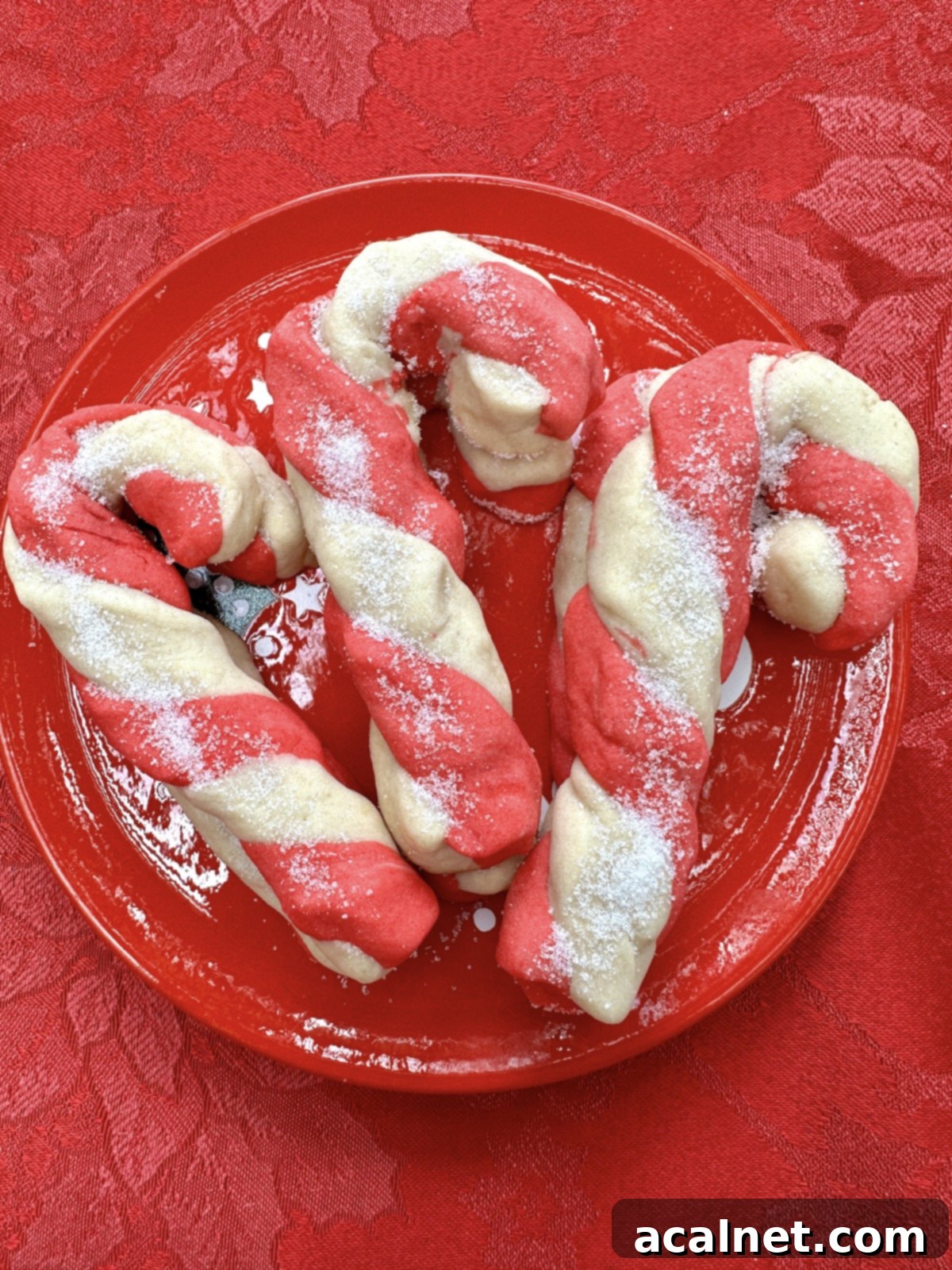 Candy cane cookies on a plate.