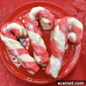 Candy cane cookies on a plate.