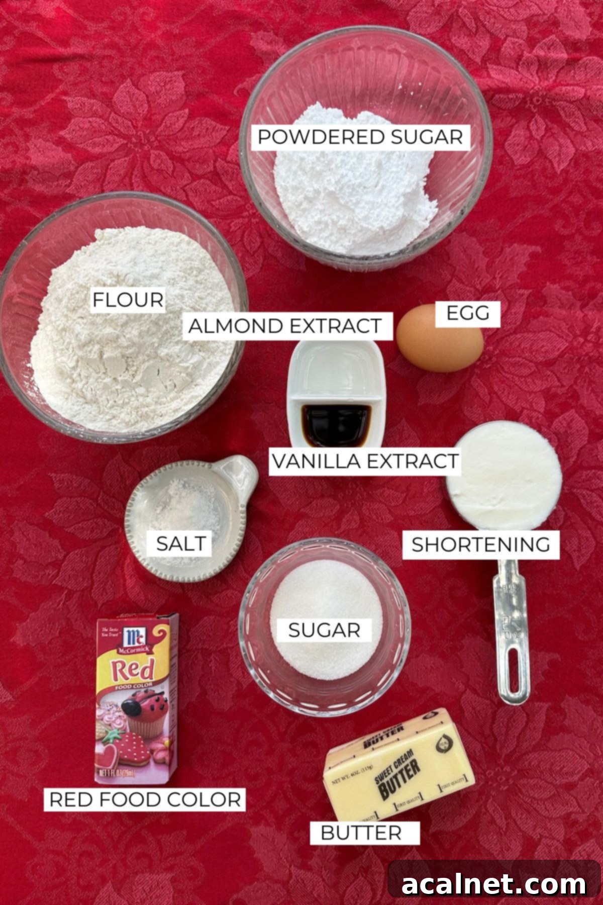 Ingredients for Christmas candy cane cookies labeled on a table.