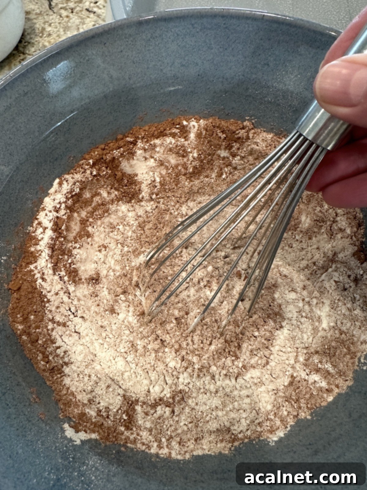Dry ingredients for chocolate zucchini cake, whisked together to ensure even distribution.