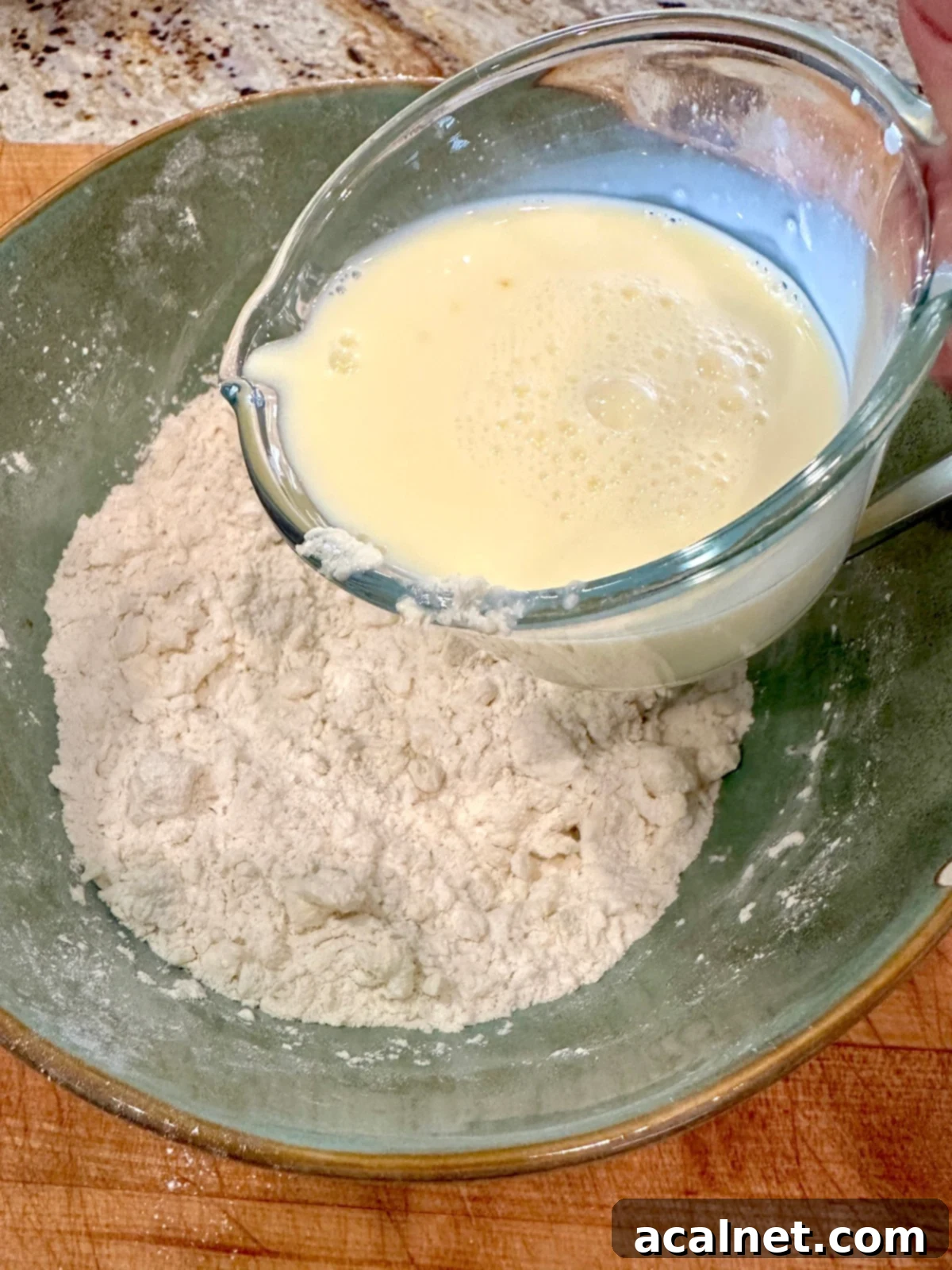 Liquid ingredients for homemade biscuits without yeast, ready to be added to the dry mixture.