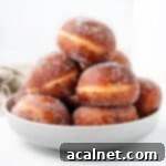 Gourmet Brioche Delights 11 Donuts stacked inside a large grey bowl.