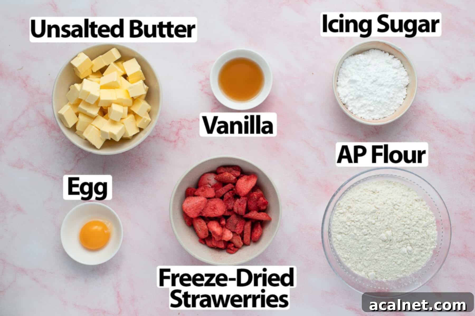 Ingredients on a pink marble surface.