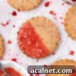 Close up on a cookie placed over white baking paper.