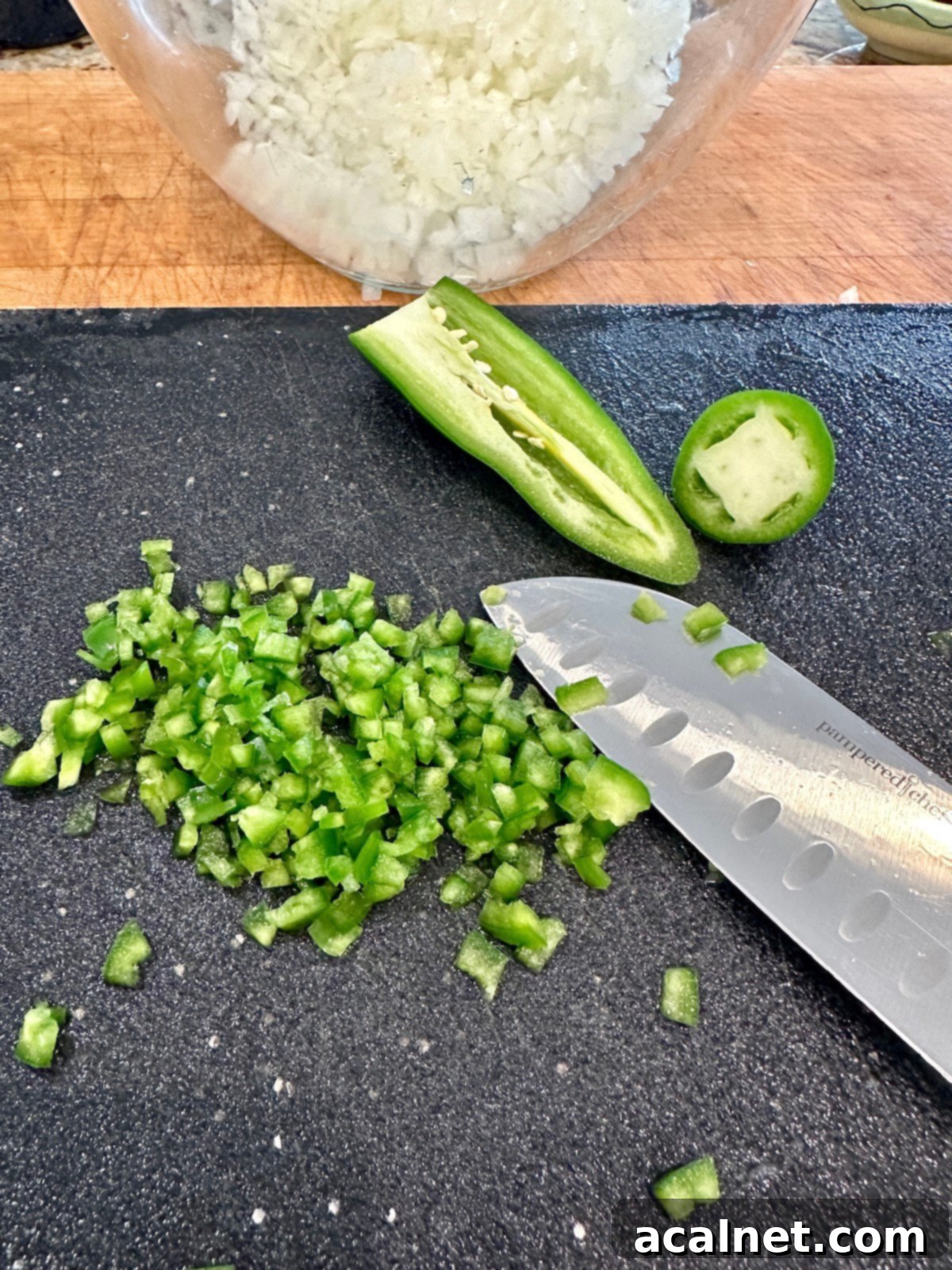 Zesty Jalapeño-Lime Pico de Gallo 8 Carefully diced jalapeño pepper and a bowl full of uniformly diced onions, ready for mixing.