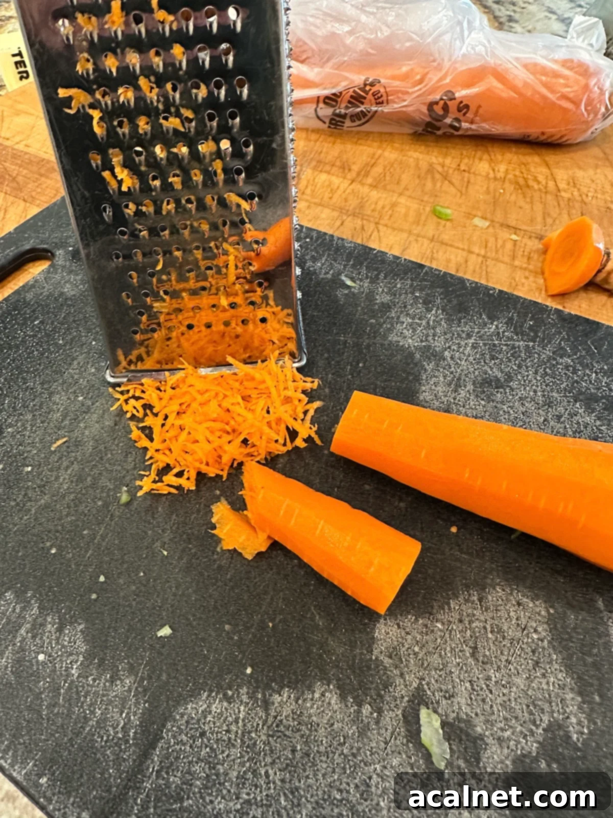 Carrots grated on a cutting board.