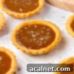 Close up on a tartlet topped with flaky sea salt.