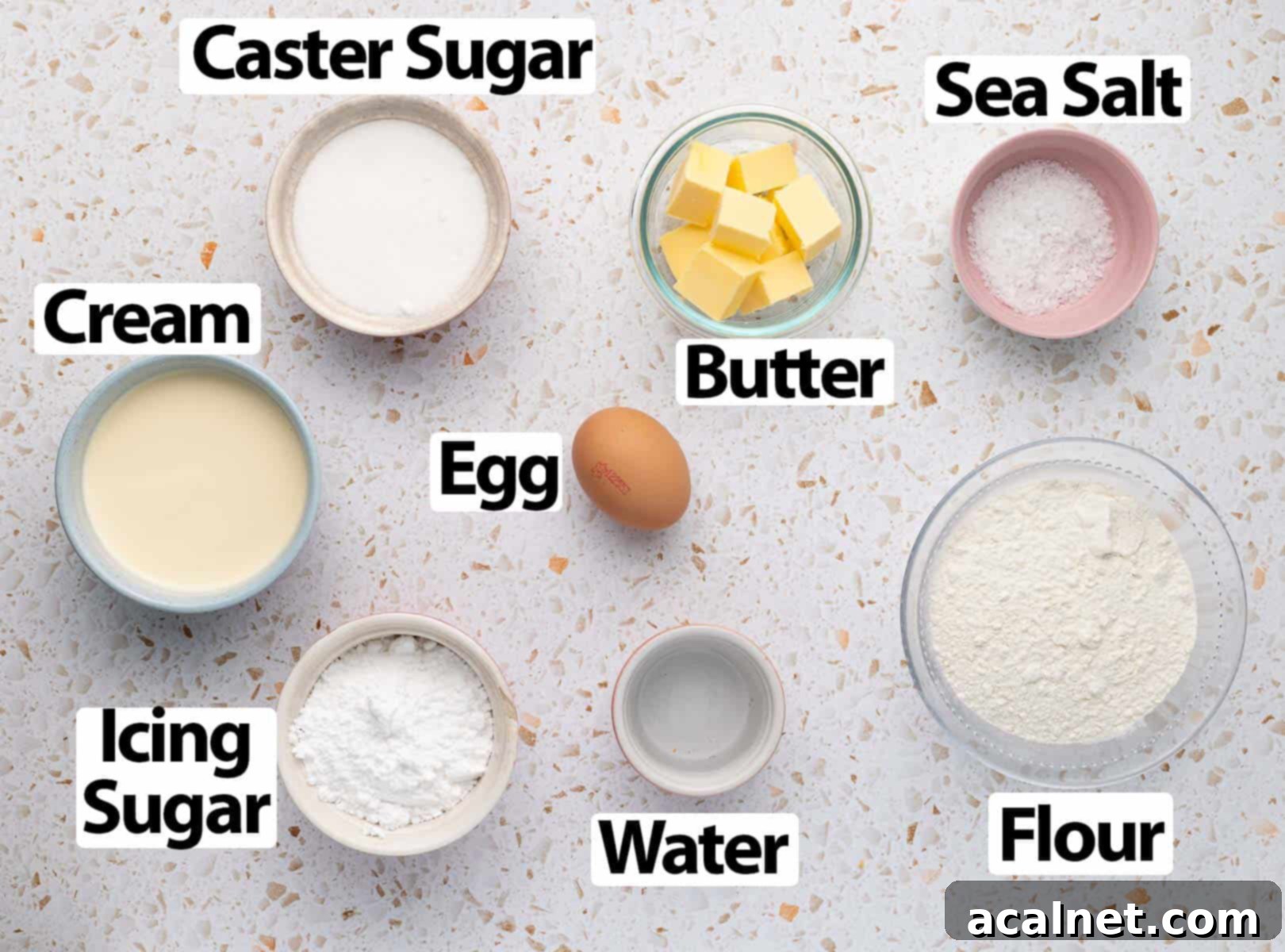 Ingredients on a white and orange terrazzo surface.