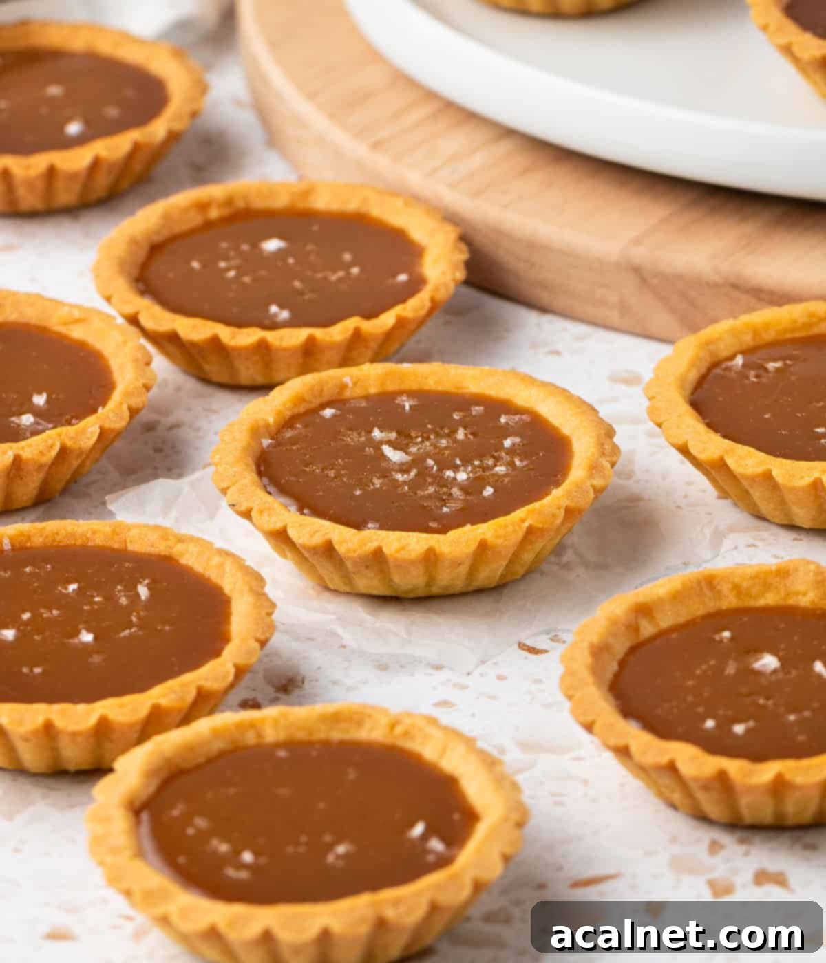 Tartlets laid on a terrazzo surface.