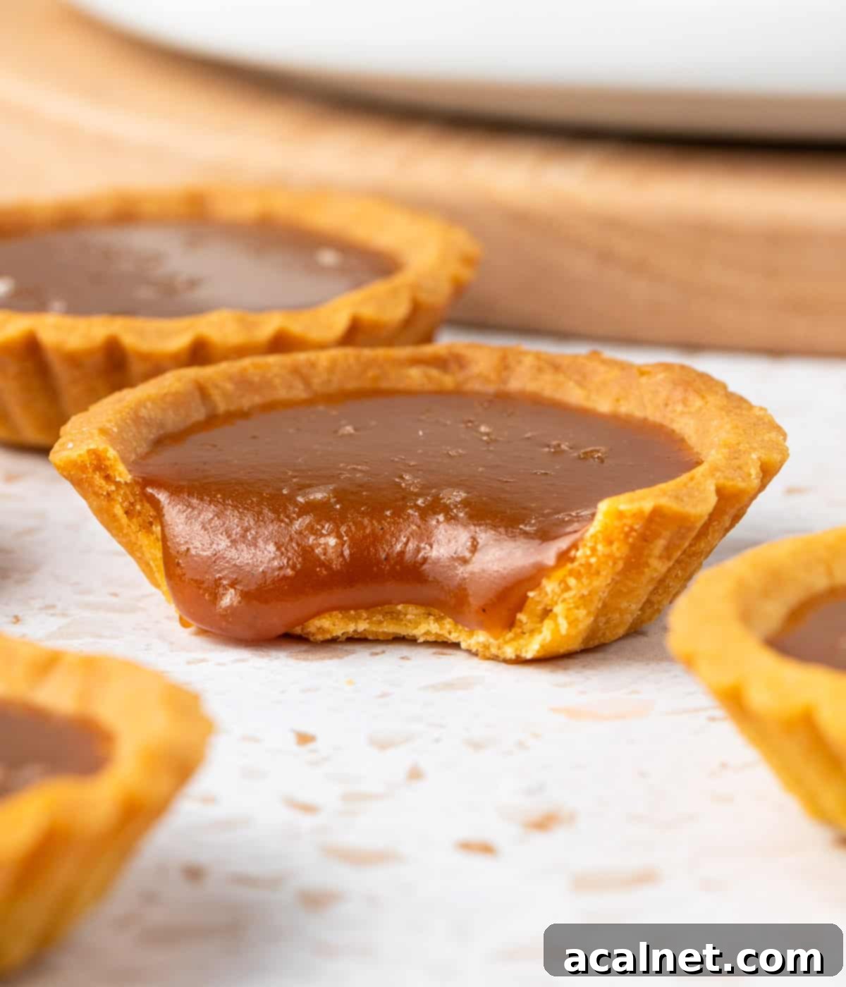 One tart with a bite taken off.