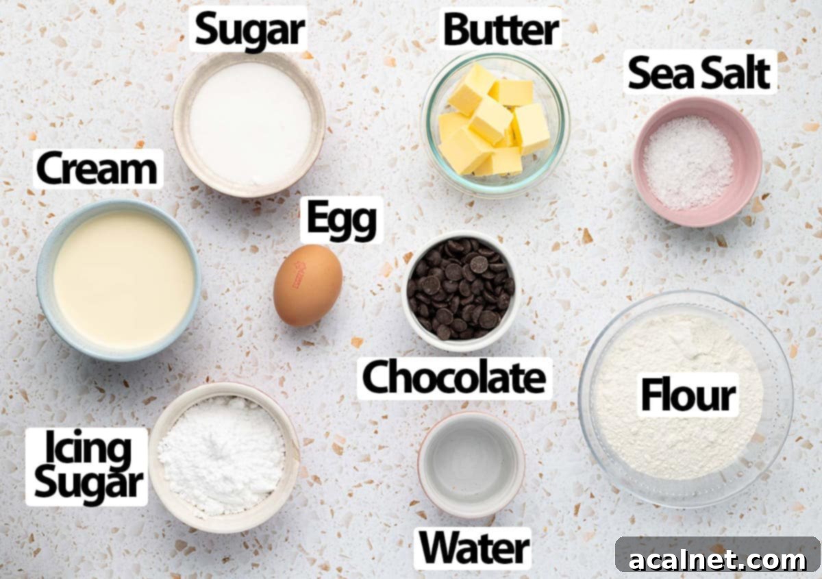 Ingredients for chocolate caramel tartlets laid out on a white surface.
