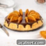 Finished Chocolate Orange Cheesecake with ganache and orange slices.