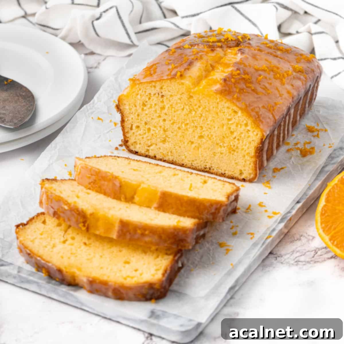 Loaf on a marble tray with three slices cut off.