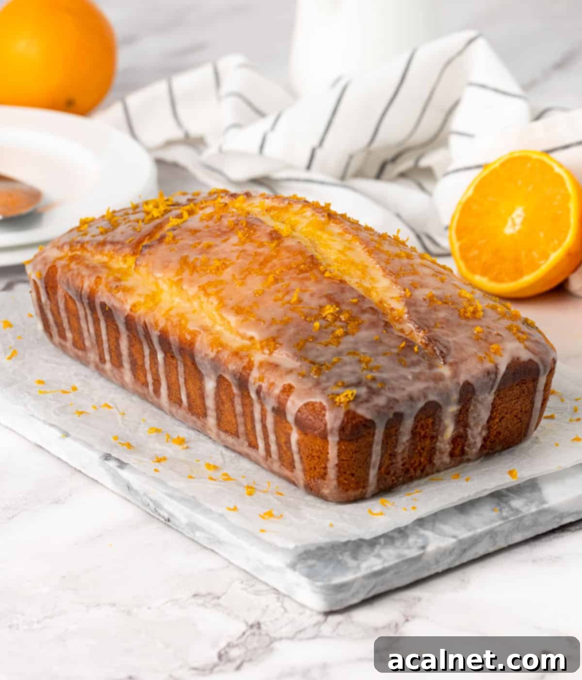 Iced loaf over a grey marble platter.