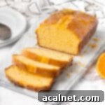 Loaf on a marble tray with three slices cut off.