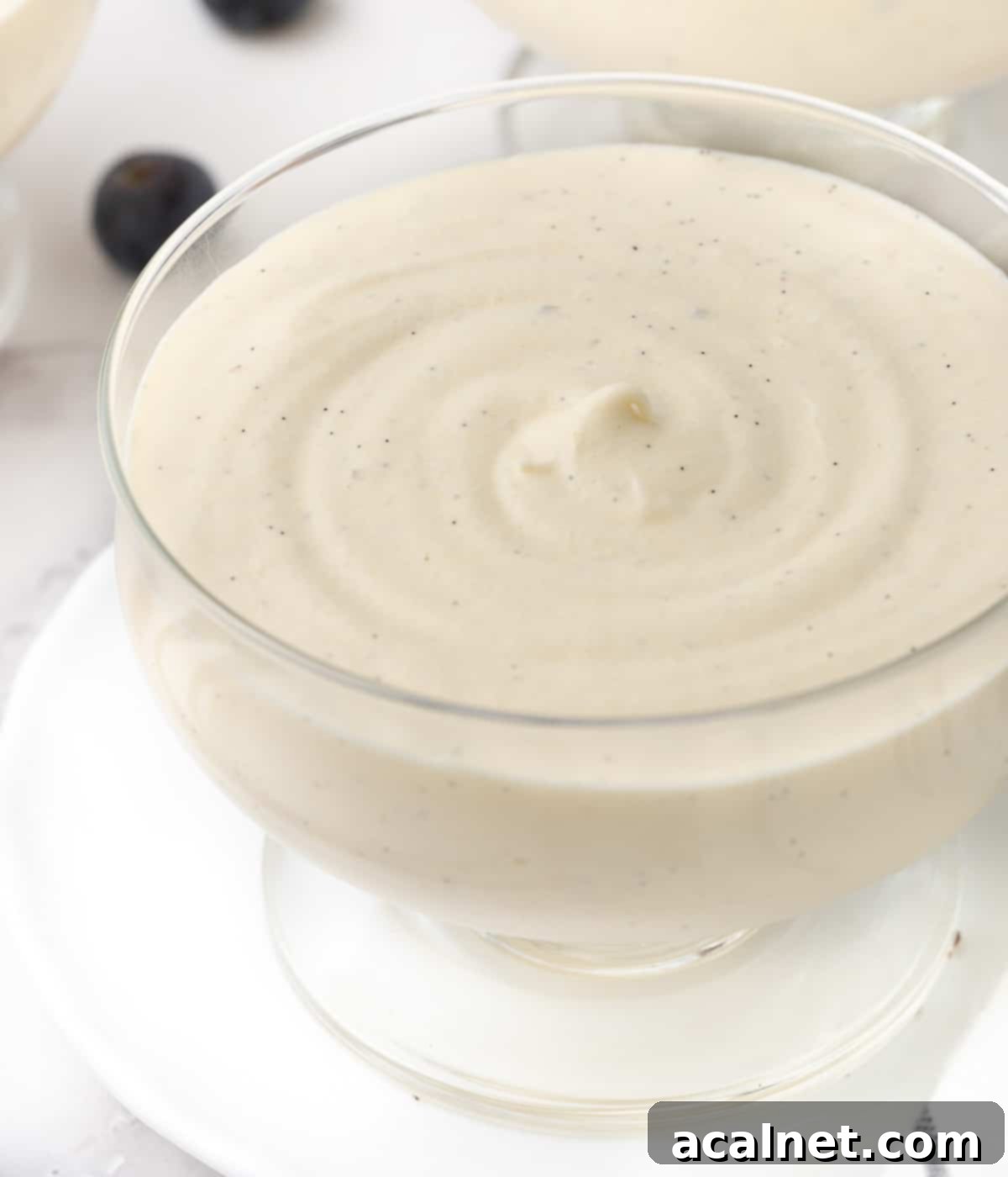 Effortless Vanilla Mousse Delights 7 Close up on the set mousse texture inside a glass cup.