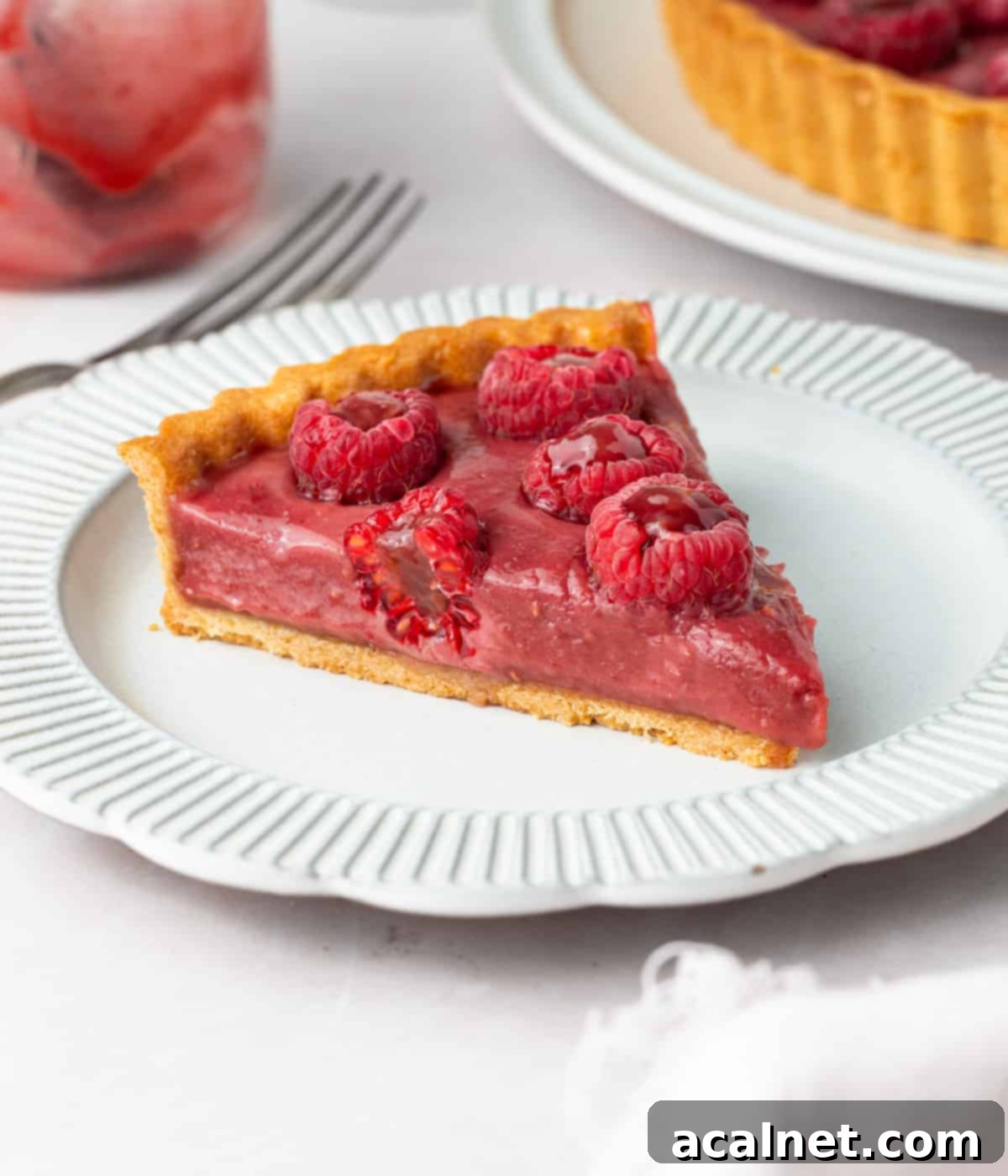 One slice of tart on a small dessert plate.