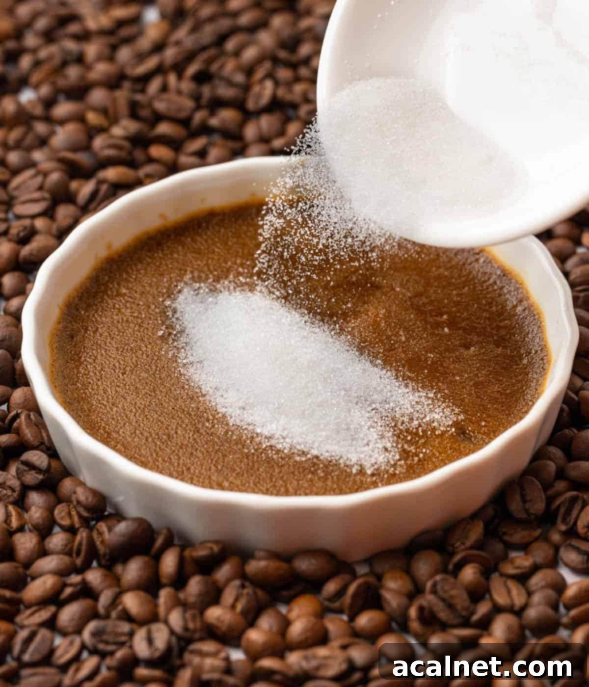 Pouring white sugar over the baked custard.