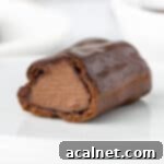 Eclair sliced in half showing the chocolate custard filling inside.