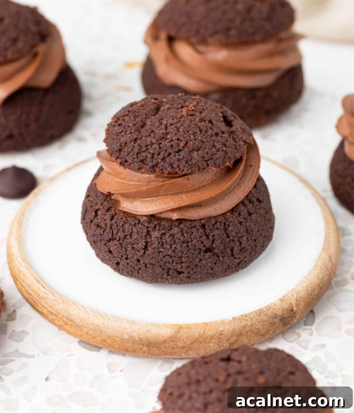 Close up on the chocolate craquelin topping on top of the piped custard.