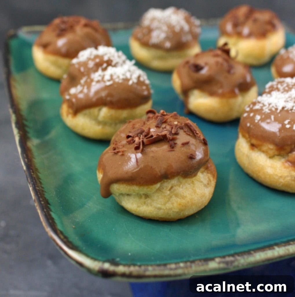 Close up on Coffee Choux Buns, showcasing their golden shell and rich glaze