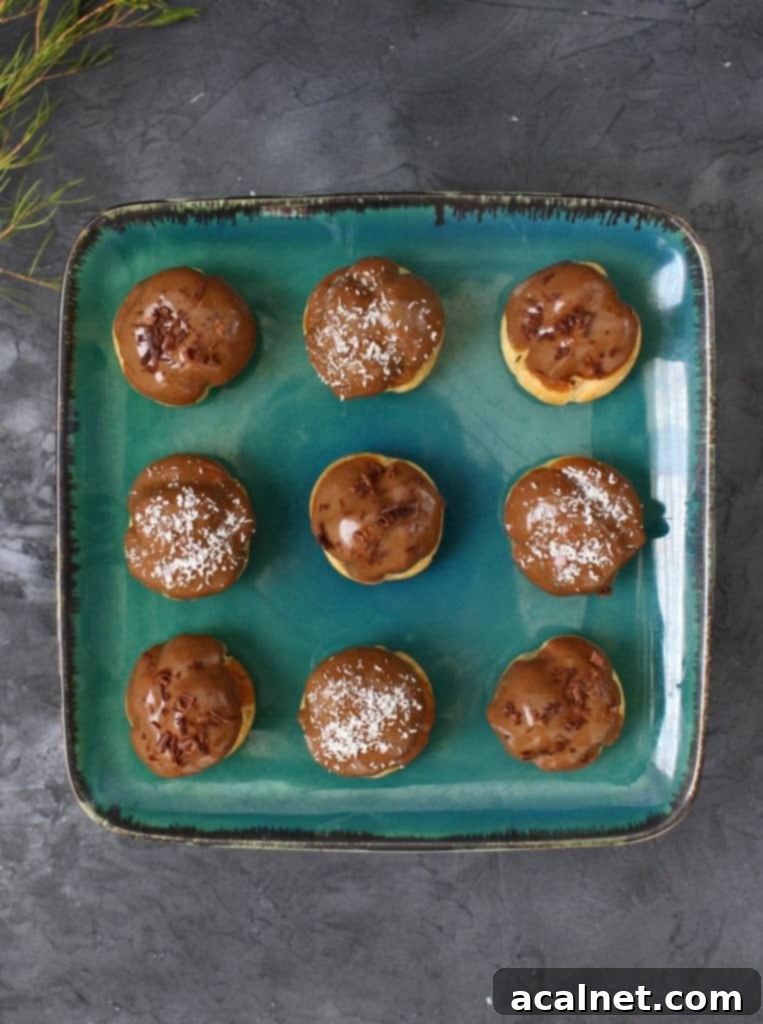 A display of freshly made Coffee Choux Buns on a cooling rack