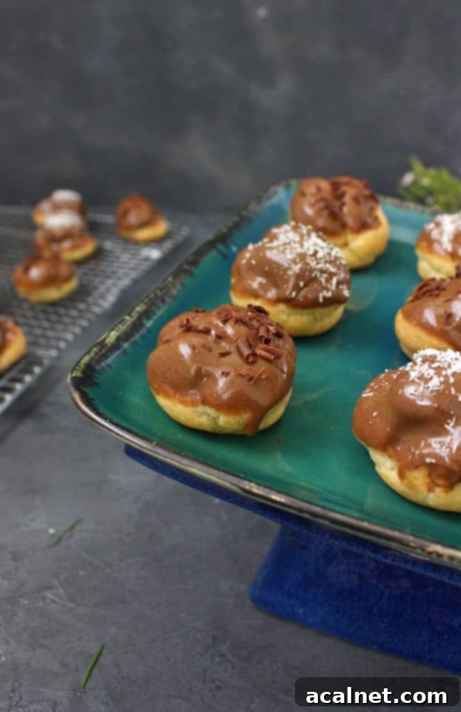 A selection of Coffee Choux Buns with a glossy cacao coffee glaze