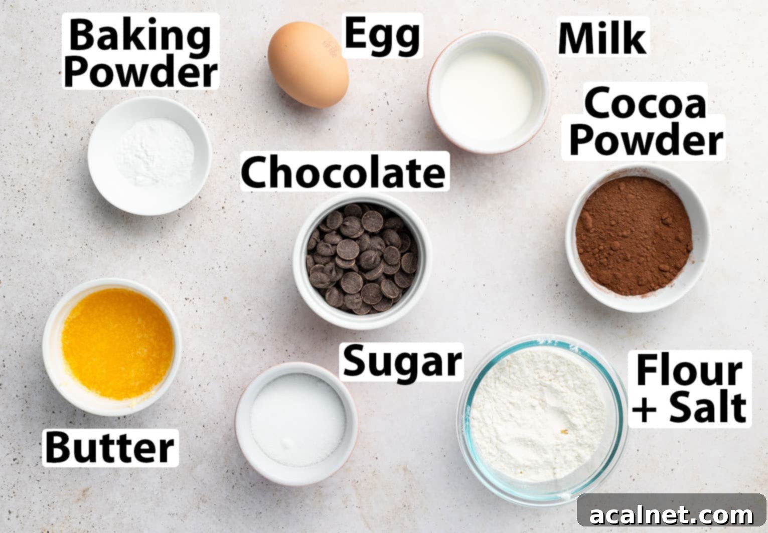 Ingredients laid on a beige surface.