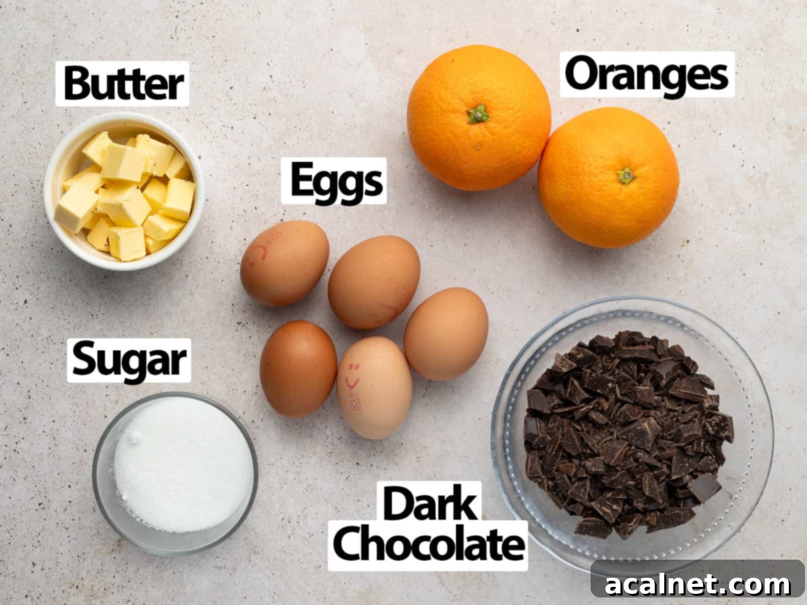 Ingredients laid on a beige surface.