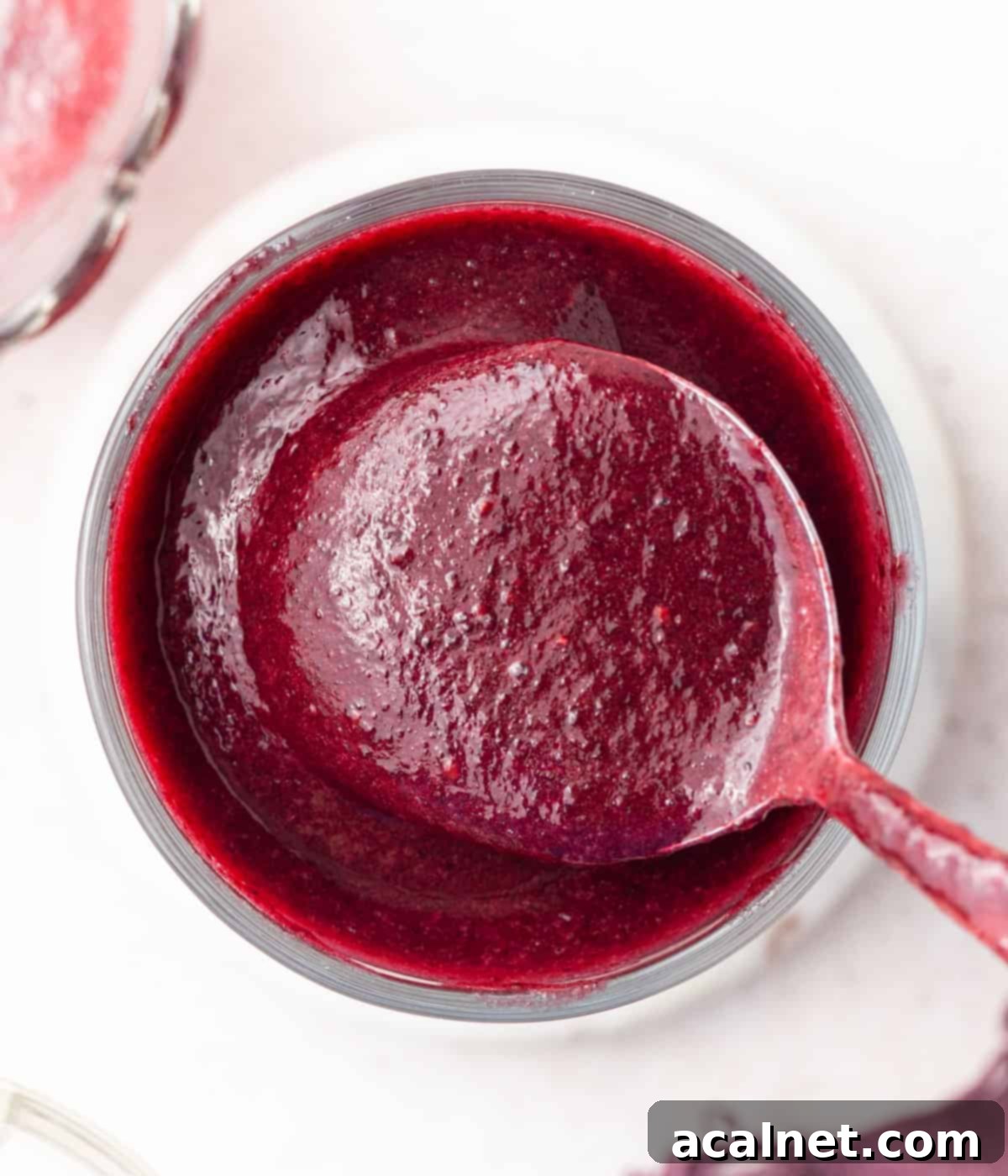 Coulis in a glass cup seen from above.