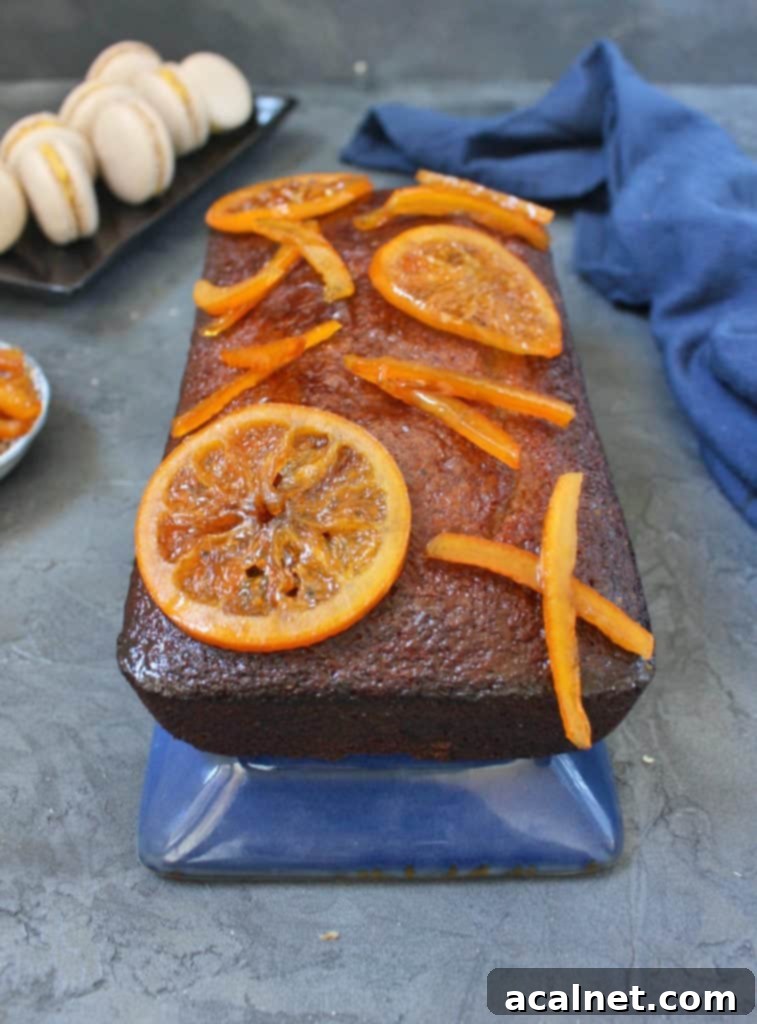 Close up on the candied oranges over the glazed cake