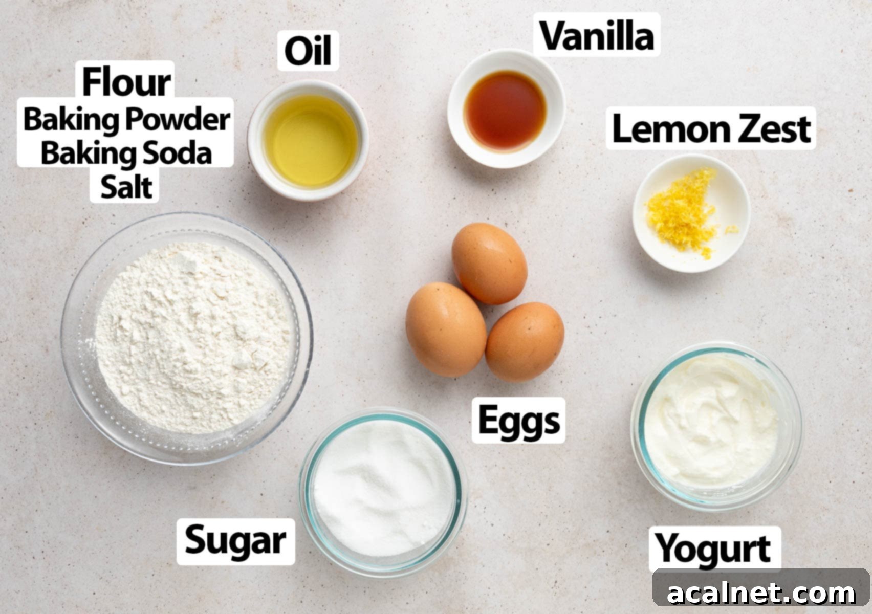 Ingredients laid on a beige surface.