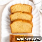 Stack of 3 slices of cake seen from above on an oval white plate.