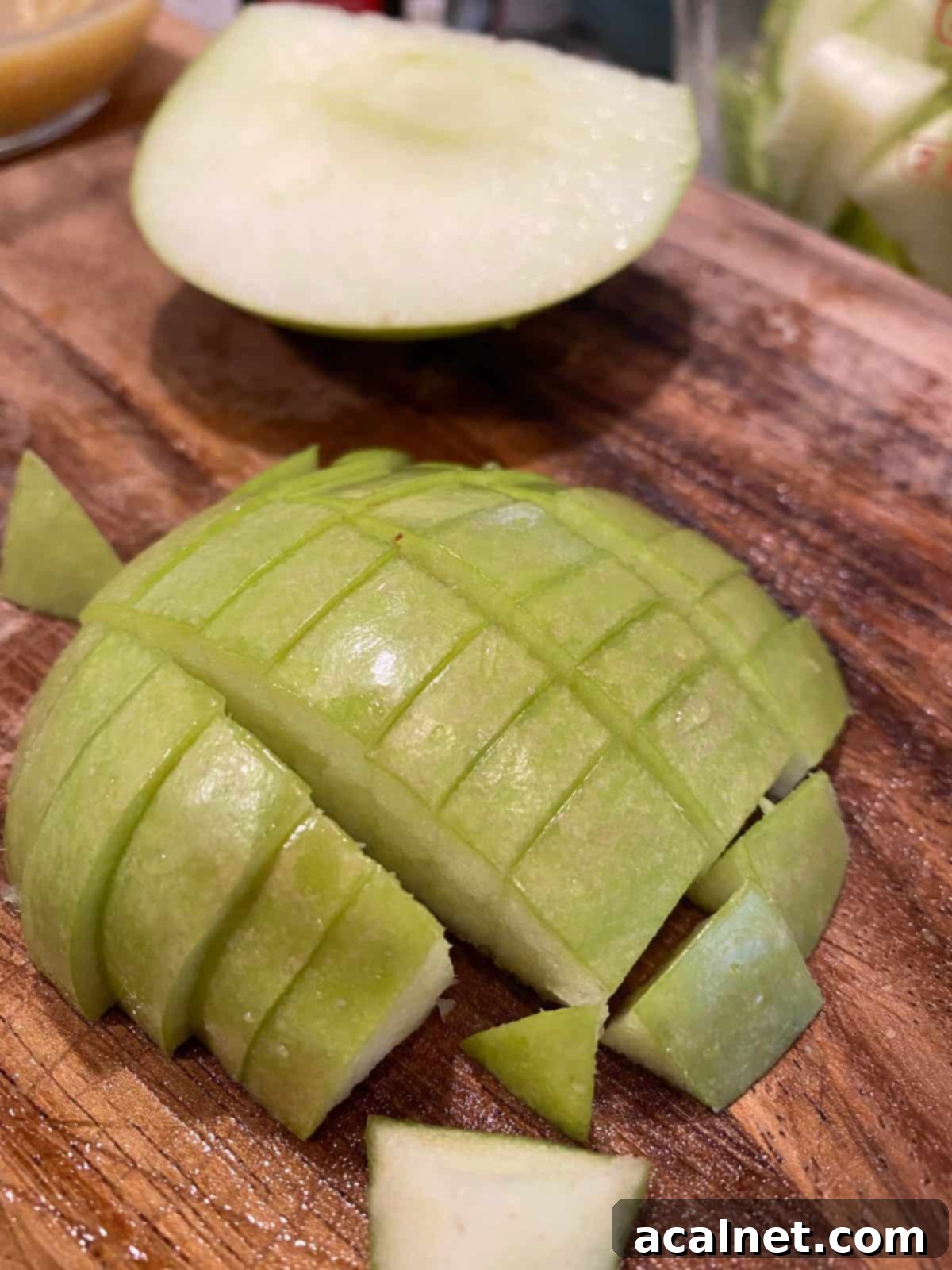 One half of an apple, skin side up and diced into small portions.
