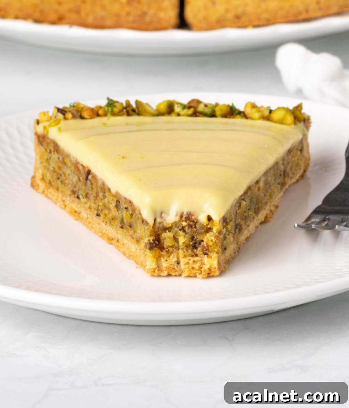 Close up on a slice of tart with a bite taken off.