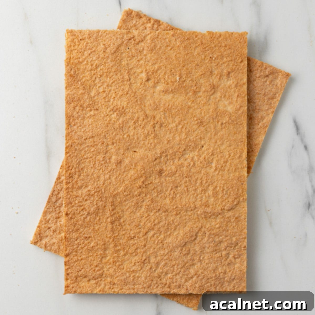 Two dacquoise sheets on top of each other seen from above.