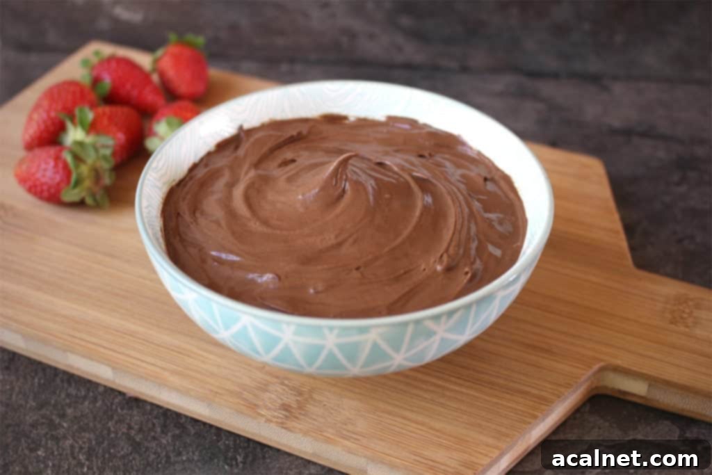 15+ Decadent Mousse Delights 5 Dark Chocolate Mousse served in a clear glass, garnished with chocolate shavings.